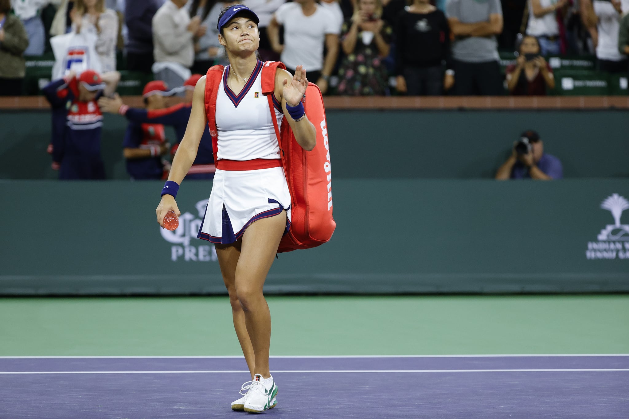 INDIAN WELLS, CALIFORNIA - OCTOBER 08: Emma Raducanu of Great Britain walks off the court after being defeated by Aliaksandra Sasnovich of Belarus during the BNP Paribas Open at the Indian Wells Tennis Garden on October 08, 2021 in Indian Wells, California. (Photo by Tim Nwachukwu/Getty Images)